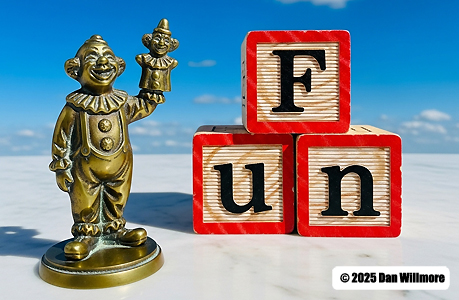 Picture of a clown with ABC blocks that spell the word "FUN."