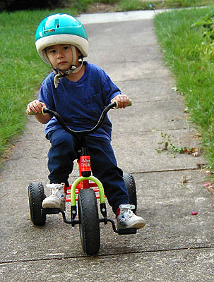 Arthur rides his tricycle